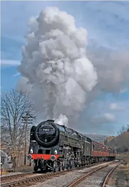  ?? ANDREW DENNISON ?? Back in the north of England, National Collection ‘Britannia’ No. 70013 powers up the gradient towards Ingrow on the first day of the Keighley & Worth Valley Railway’s gala.