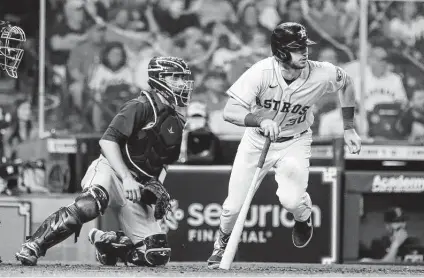  ?? Photos by Karen Warren / Staff photograph­er ?? Kyle Tucker digs for first as he brings home the Astros’ second run with a single to score Alex Bregman in the fourth inning.