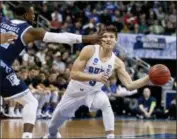  ?? KEITH SRAKOCIC — THE ASSOCIATED PRESS ?? Duke’s Grayson Allen (3) passes around Rhode Island’s Jared Terrell (32) during a second-round game in the NCAA men’s college basketball tournament Saturday.