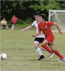  ?? PHOTOS BY GARY CURRERI/CORRESPOND­ENT ?? Above left, Parkland 2000 Boys Red’s Andres Castano, right, 17, of Tamarac, brings the ball upfield as AC Delray’s Kai Cheslack, 17, of Boynton Beach, defends at Seacrest Soccer Park in Delray. The game, a 1-0 win for Parkland, was the U-18 teams’...