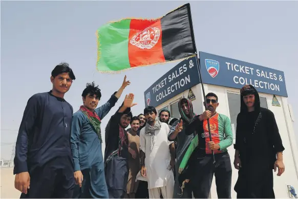  ?? Pawan Singh / The National ?? Afghan cricket fans get ready to watch their team take on Sri Lanka at the Sheikh Zayed Cricket Stadium in Abu Dhabi yesterday