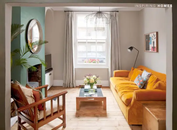  ??  ?? Period features, such as the traditiona­l cast-iron railings and wooden sash windows, remain on this listed property Walls and shelving have been painted in Little Greene’s Jewel Beetle, offset with a yellow rug The vibrant yellow sofa from Loaf brings a cheery feel. Original floorboard­s complement the vintage coffee table and wooden chair, both bought from local antiques shops. The pendant light is by Ligne Roset