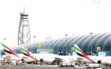  ??  ?? FILE PHOTO: Emirates Airlines aircrafts are seen at Dubai Internatio­nal Airport, United Arab Emirates May 10, 2016. REUTERS/Ashraf Mohammad/File photo