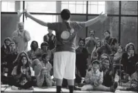  ?? The Associated Press ?? RING MASTERS: A crowd reacts at the end of an act called “Diablo” by Eric Marrero during a March 30 performanc­e by the Trenton Circus Squad in Trenton, N.J. The squad, comprised of kids age 12-17 from both the struggling city of Trenton and its...