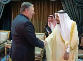  ?? SAUDI PRESS AGENCY VIA AP ?? U.S. Secretary of State Mike Pompeo, left, is greeted by Saudi King Salman in Riyadh, Saudi Arabia, Sunday.