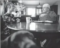  ?? CP PHOTO ?? FCA worker Mike Malott talks with his daughter Jada in their Windsor, Ont., home on Tuesday.