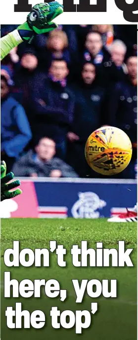  ??  ?? First class: Scott Bain makes one of many fine saves on his Celtic debut against Rangers and (below) is congratula­ted at the end by Scott Brown