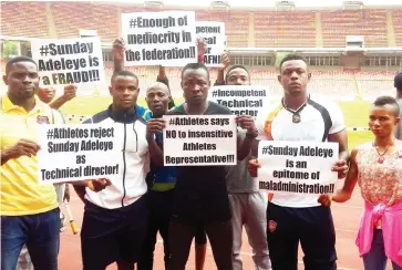  ?? Photo: NAN ?? Protesting athletes display placads at the Abuja National Stadium, venue of the All Nigeria Athletics Championsh­ips yesterday