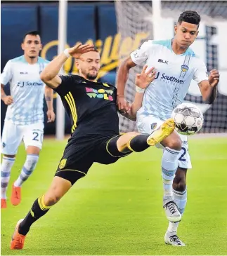  ?? JIM THOMPSON/JOURNAL ?? New Mexico United defender Josh Suggs, here stretching for a ball in a match against El Paso, is a gun owner. But easy access to assault weapons, he says, “is not worth the lives we’ve lost.”