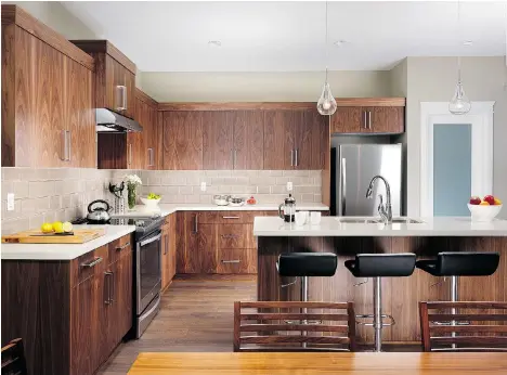  ??  ?? Above, buyers can choose from three colour schemes, including classic Shaker-style or contempora­ry flat-panel kitchen cabinets with brushed chrome hardware. Right, kitchens have designer-laminate counters and a Whirlpool Energy Star stainless steel appliance package.