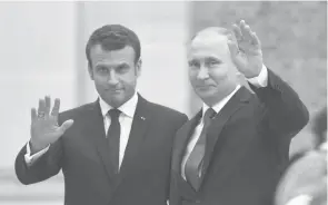  ??  ?? Le président Emmanuel Macron (g) et son homologue russe Vladimir Poutine au château de Versailles, près de Paris, le 29 mai 2017