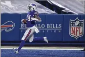  ?? ADRIAN KRAUS — THE ASSOCIATED PRESS ?? The Bills’ Taron Johnson returns an intercepti­on for a touchdown during the second half of their AFC divisional round playoff game against the Ravens on Saturday.