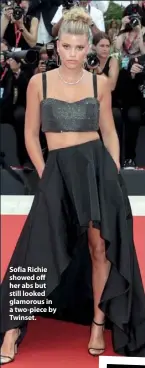  ??  ?? Sofia Richie showed off her abs but still looked glamorous in a two-piece by Twinset.