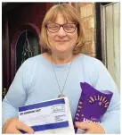  ??  ?? Caroline Cooper, who bakes cakes to put a smile on the face of key workers