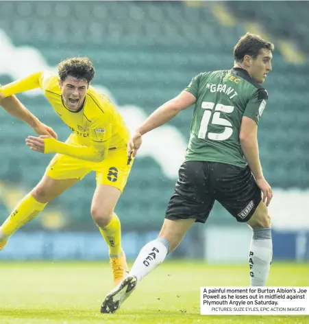  ?? PICTURES: SUZE EYLES, EPIC ACTION IMAGERY ?? A painful moment for Burton Albion’s Joe Powell as he loses out in midfield against Plymouth Argyle on Saturday.