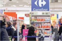  ?? — Reuters ?? Shoppers are seen inside Carrefour store in Paris, France.