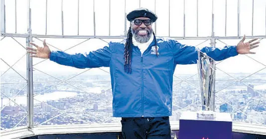  ?? ?? Chris Gayle displays the ICC Men’s T20 World Cup Trophy atop the Empire State Building in New York yesterday.