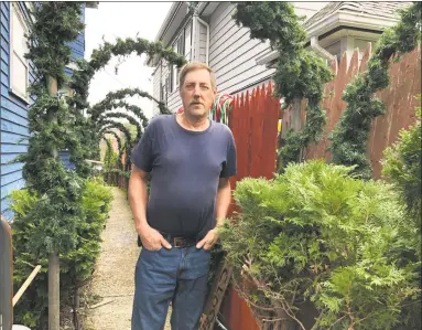  ?? Leslie Hutchison / Hearst Connecticu­t Media ?? Ron Merriman in front of his Main Street home, locally known as the Christmas House, where the family faces a March 4 eviction.