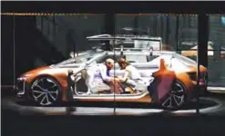  ??  ?? FRANKFURT: A couple sits inside the Renault prototype Symbioz during its world premiere during a show on stage at the Renault stand at the Frankfurt Motor Show IAA in Frankfurt am Main, western Germany, yesterday. —AP