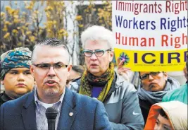  ?? JAMES FOSTER/ CHICAGO SUN-TIMES VIA THE ASSOCIATED PRESS ?? Chicago Alderman Gilbert Villegas speaks Tuesday at a gathering of residents and leaders after a shooting by immigratio­n officials left a man hospitaliz­ed.