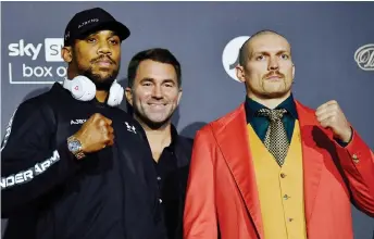  ?? — AFP photo ?? Joshua (left) and Usyk during a press conference at Tottenham Hotspur Stadium in London.