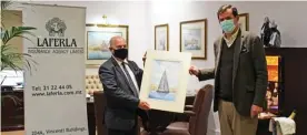  ??  ?? Mr Mark Laferla Sr (left) presents Mr Felipe Navarro Lopez de Chicheri (right) with a painting of