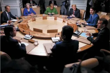  ?? EVAN VUCCI — THE ASSOCIATED PRESS ?? Clockwise from top left, President of the European Council Donald Tusk, British Prime Minister Theresa May, German Chancellor Angela Merkel, U.S. President Donald Trump, Canadian Prime Minister Justin Trudeau, French President Emmanuel Macron, Japanese...