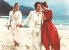  ?? Orion Pictures 1979 ?? Bo Derek (left) and Julie Andrews both appeared in the movie “10.” That’s Dudley Moore in the middle.