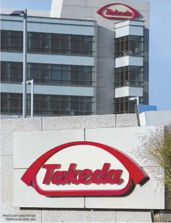  ??  ?? NEW HUB: Takeda Pharmaceut­ical Co., seen at right at its current headquarte­rs in Deerfield, Ill., will be moving to the Boston area. PHOTO BY KRISTOFFER TRIPPLAAR/SIPA USA