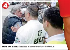  ??  ?? OUT OF LINE: Nastase is escorted from the venue