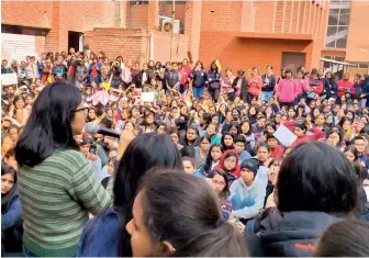  ?? PTI ?? Delhi Commission For Women chief Swati Maliwal (in green sweater) addresses students during a protest at Gargi College in New Delhi on Monday. —