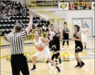  ?? MARK HUMPHREY ENTERPRISE-LEADER ?? A referee stops action spotting a foul while Prairie Grove sophomore Jasmine Wynos battles a trio of Lincoln players for control of the basketball. The Lady Tigers defeated their rival, 40-33, on Dec. 4.