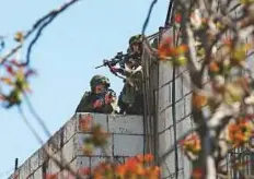  ?? AFP ?? Top: Israeli occupation forces aim their weapons towards Palestinia­n demonstrat­ors yesterday during clashes in occupied West Bank city of Hebron as a general strike was called for by local leaders.