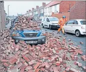  ?? ?? Car covered by fallen bricks in Sunderland