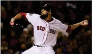  ?? AP PHOTO BY DAVID J. PHILLIP ?? Boston Red Sox’s starting pitcher David Price winds up to throw Wednesday, Oct. 24, in Boston.