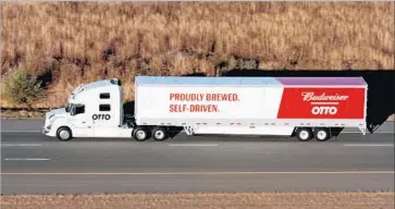  ?? AFP/Getty Images ?? OTTO, which partnered with Anheuser-Busch to carry 51,744 cans of Budweiser in Colorado, uses a system of cameras, radar and laser-based lidar sensors that control the truck’s accelerati­on, braking and steering.