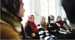  ??  ?? COLOGNE: A history teacher teaches Muslim females German history in a classroom of the “Muslim education center Cologne” in Cologne, western Germany, yesterday.—AFP