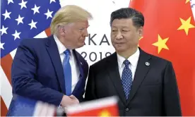  ?? Photograph: Susan Walsh/AP ?? Donald Trump, left, shakes hands with Xi Jinping during a meeting on the sidelines of the G20 summit in Osaka, Japan, in 2019.