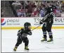  ?? LYNNE SLADKY — AP ?? Washington's Alex Ovechkin smiles at his son Sergei, 4, after he scored a goal during the NHL All Star Skills Showcase.