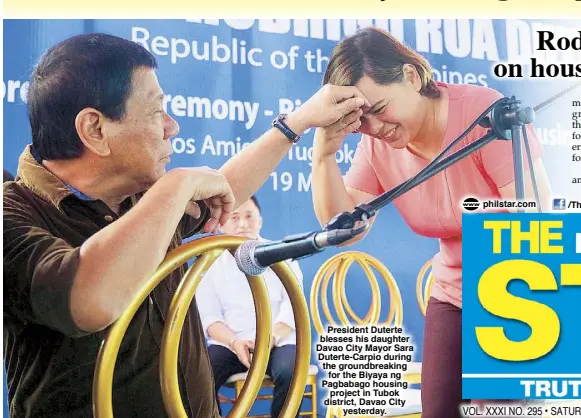  ??  ?? President Duterte blesses his daughter Davao City Mayor Sara Duterte-Carpio during the groundbrea­king for the Biyaya ng Pagbabago housing project in Tubok district, Davao City yesterday.