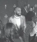  ?? JOE RONDONE/THE REPUBLIC ?? Cowboys quarterbac­k Dak Prescott walks the red carpet before the NFL Honors awards show in Phoenix on Thursday.