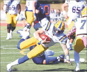  ?? Arnold Gold / Hearst Connecticu­t Media ?? UNH quarterbac­k Christian Lupoli runs against SCSU in the first half on Saturday.