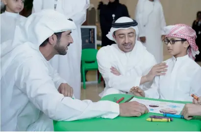  ?? — Wam ?? Sheikh Hamdan and Sheikh Abdullah with a young participan­t at the Mohammed bin Rashid Space Centre’s science event.