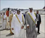  ?? KUWAIT NEWS AGENCY / AP ?? Qatari Foreign Minister Sheikh Mohammed bin Abdulrahma­n Al Thani (left) and Kuwaiti Foreign Minister Sheikh Sabah Khaled Al Sabah walk together on an airport tarmac Monday. Al Thani carried a handwritte­n letter from Qatar’s ruling emir.