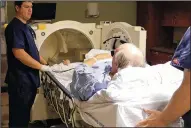  ?? PHIL GALEWITZ/KAISER HEALTH NEWS ?? A patient is placed in a hyperbaric oxygen chamber at the Virginia Hospital Center in Arlington, Va.