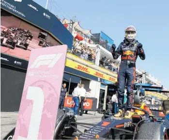  ?? Photos / AP ?? Red Bull’s Max Verstappen holds his fists in victory while standing atop his car after winning the French Grand Prix.