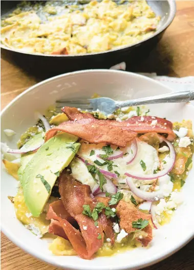  ?? GRETCHEN MCKAY/PITTSBURGH POST-GAZETTE ?? Chilaquile­s verde topped with bacon and avocado at Provisions Local Kitchen in Driggs, Idaho.