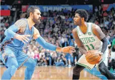  ?? [PHOTO BY BRYAN TERRY, THE OKLAHOMAN] ?? Oklahoma City’s Steven Adams (12) guards Boston’s Kyrie Irving (11) Thursday.