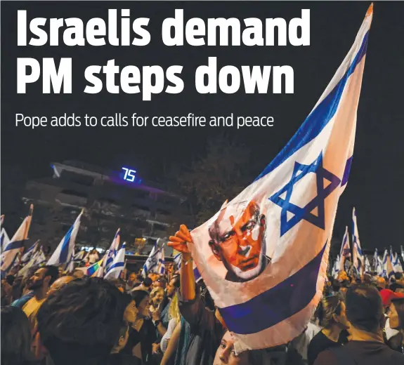 ?? ?? Angry protesters in Jerusalem wave banners depicting the bloodied face of Israeli Prime Minister Benjamin Netanyahu as they call for his immediate resignatio­n. Pictures: AFP