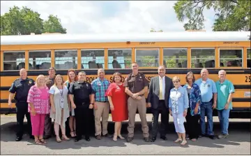  ?? kevin myrick ?? Officials from Polk Against Drugs and the Polk School District gathered at the central office in Cedartown to make a bus doantion official. It is slated to be converted as a mobile classroom teaching youth about the dangers of drugs and alochol.